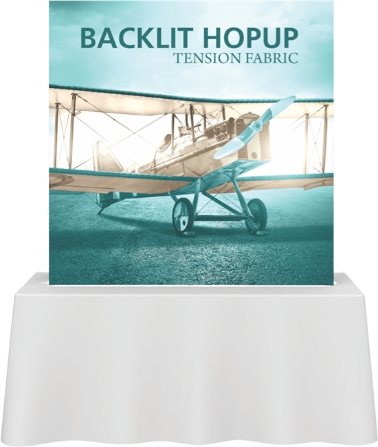 Backlit Hopup tabletop display lit up on a trade show table